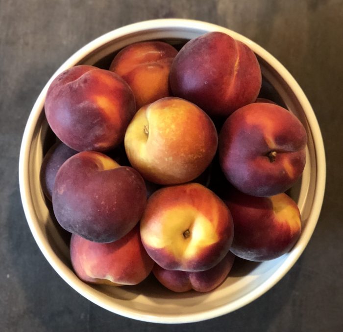 Have you wanted to try making fruit butter but thought it seemed too hard or didn't want to deal with all that peeling? You're in luck. This simple no-peel fresh peach butter is easy to make and tasty! And the best part? You don't have to PEEL anything! I made mine with honey to sweeten and cinnamon and ginger to spice it up, but you can personalize it completely to your own tastes.