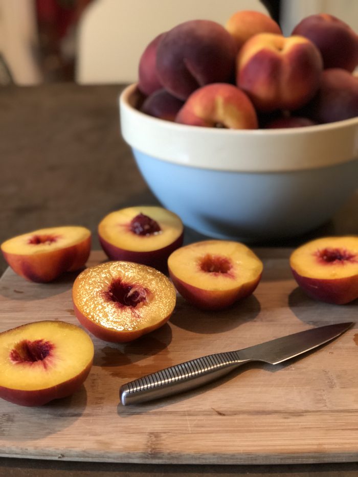 Have you wanted to try making fruit butter but thought it seemed too hard or didn't want to deal with all that peeling? You're in luck. This simple no-peel fresh peach butter is easy to make and tasty! And the best part? You don't have to PEEL anything! I made mine with honey to sweeten and cinnamon and ginger to spice it up, but you can personalize it completely to your own tastes.