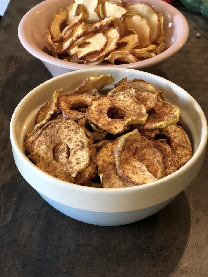 With fall comes an abundance of apples which is a perfect excuse to make dehydrated spiced apples. These apple chips are great plain, but I'm also going to show you how to spice them up a bit (using dried spices or essential oils) to make them even better! Dehydrated spiced apples are one of nature's perfect (healthy) candies. And they're addictive...but they're also easy to make so eat away!