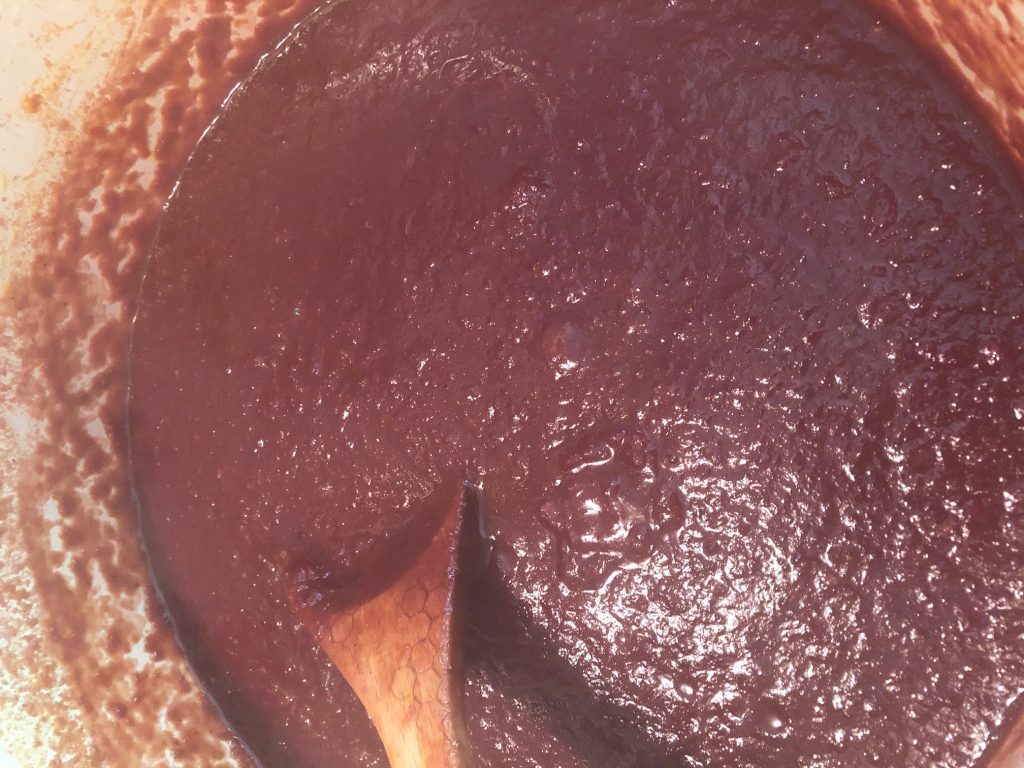 Simmering cherry bourbon BBQ sauce.